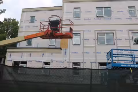 Construction lift in front of a building that is under construction in Hanover, New Hampshire.