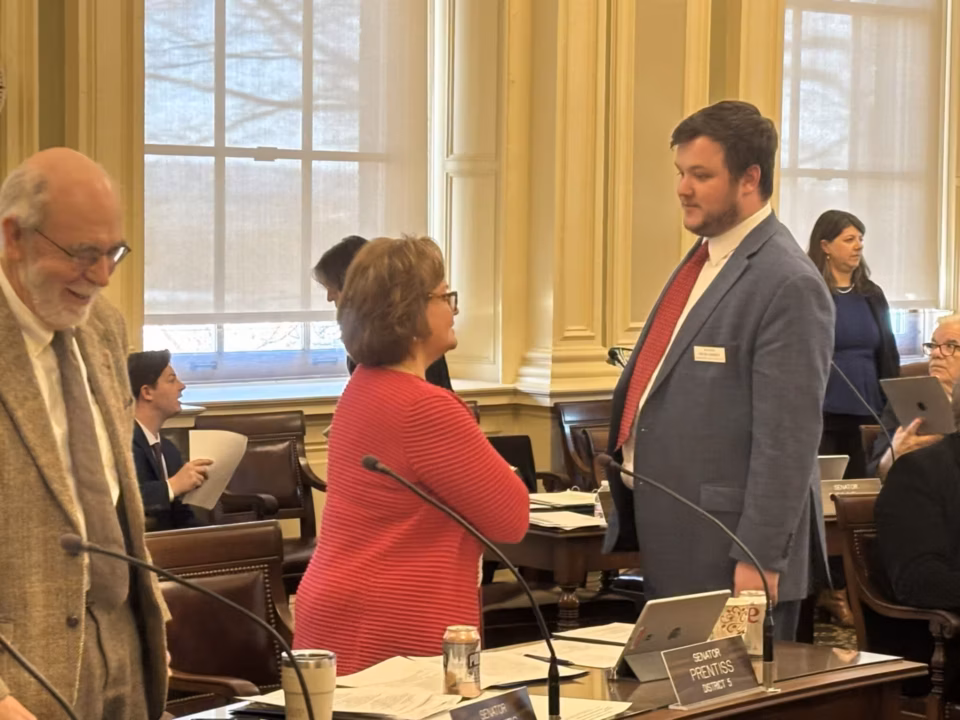 New Hampshire state senators speak to each other during a break on Thursday, February 19, 2026.